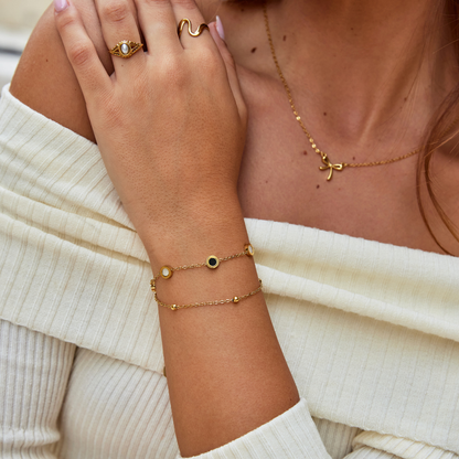 Onyx – Armband med onyx och vita stenar