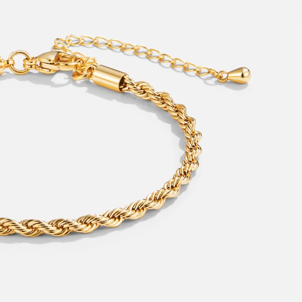 Elegant flätat armband i guld